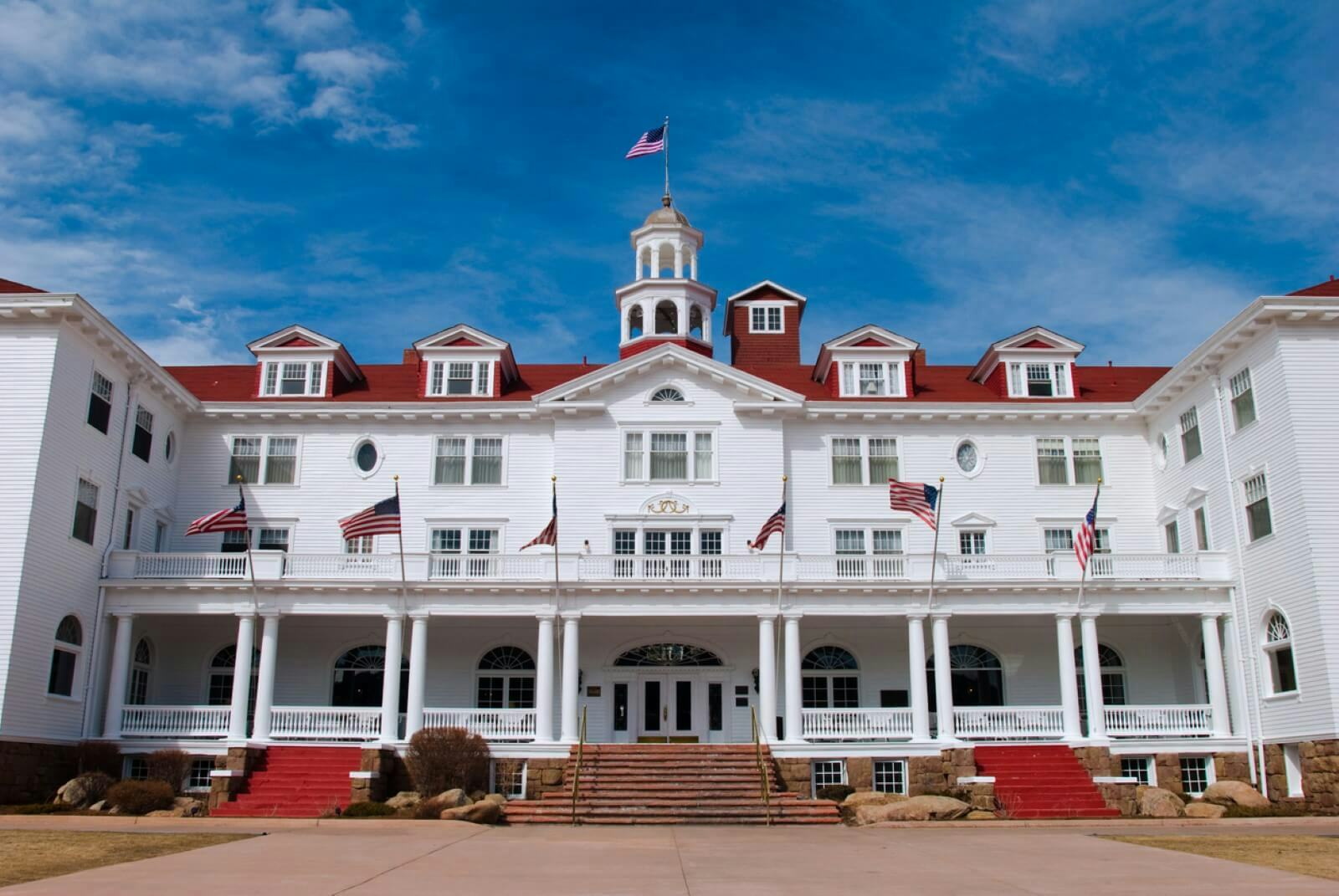 The grand white entrance of the Stanley Hotel near Estes Park, Colorado