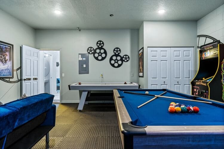 games room with pool table and arcade game