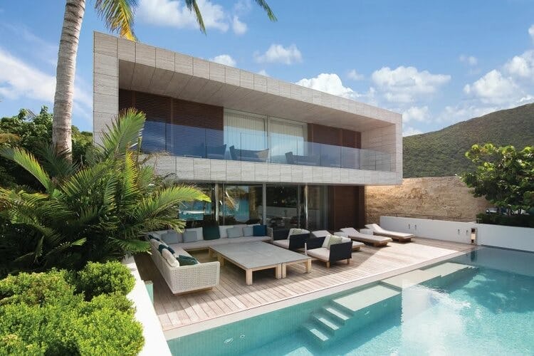 modern villa with loungers and pool