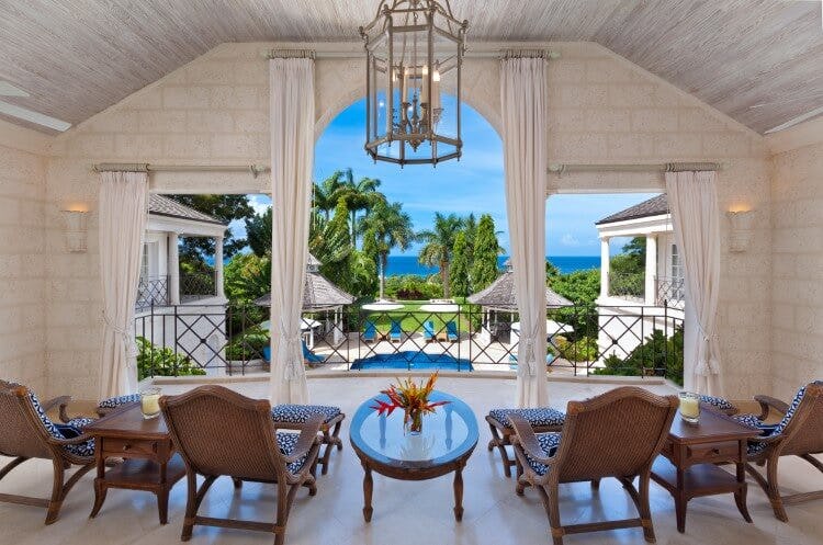large balcony overlooking pool and ocean