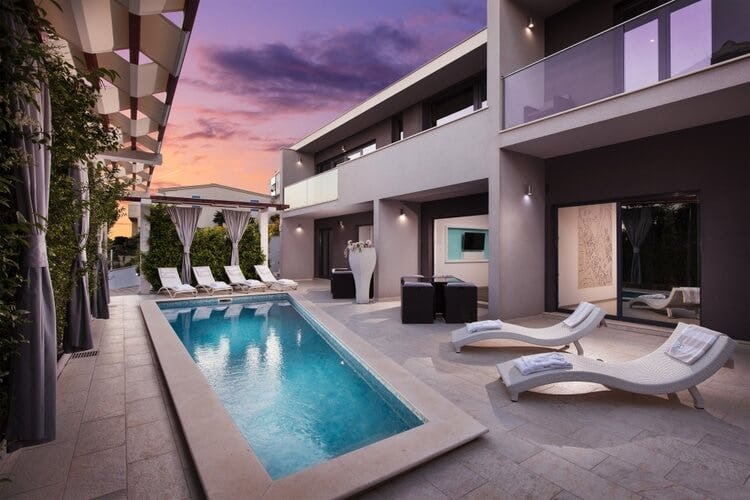 modern villa with pool in patio