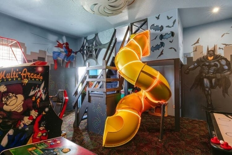 Reunion resort 9000 superhero themed room with slide