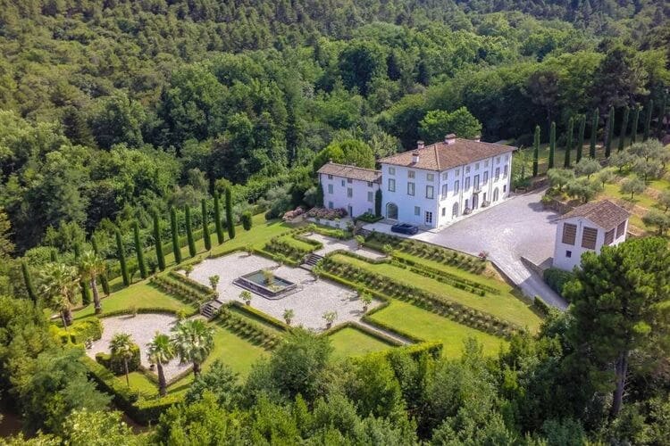 aerial view of a traditional white villa in tuscany