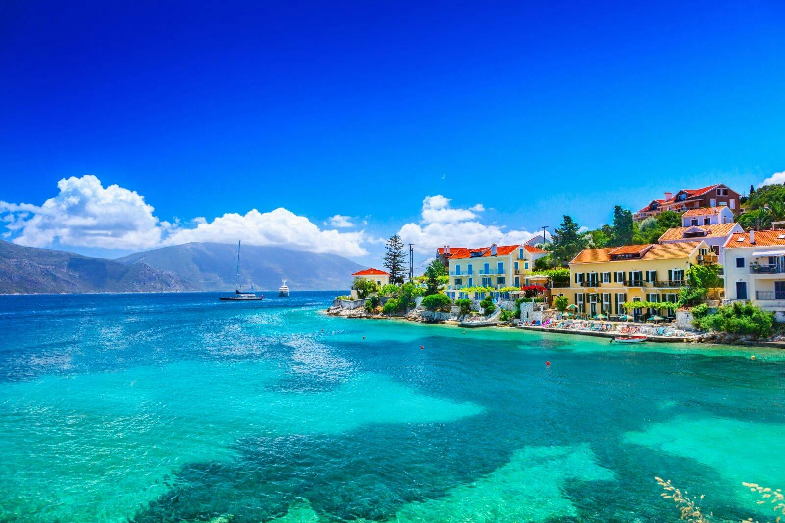 bright blue sea and bright buildings in kefalonia
