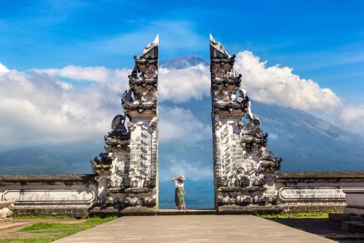 temple in bali with woman standing in shot
