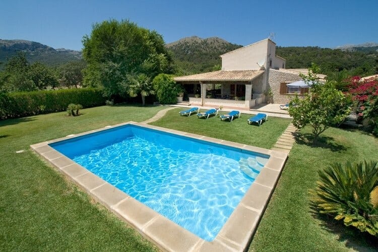 stone villa with pool in lawn