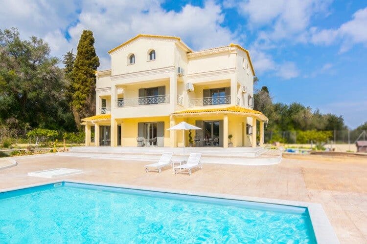 yellow villa with pool