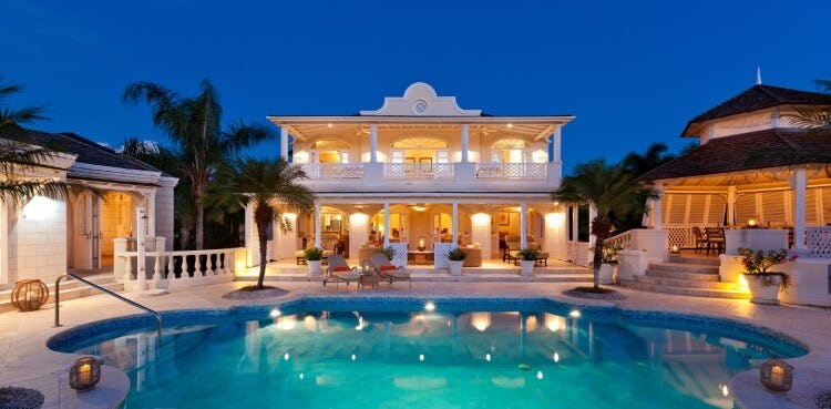 white villa and pool and dusk
