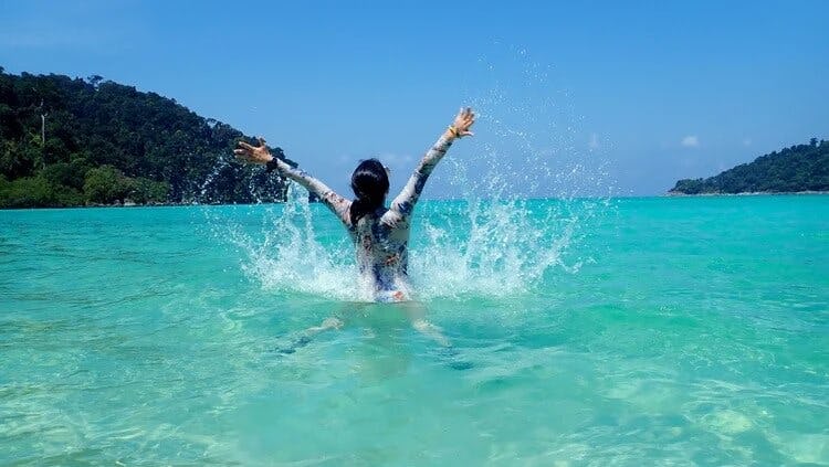 woman splashing in ocean