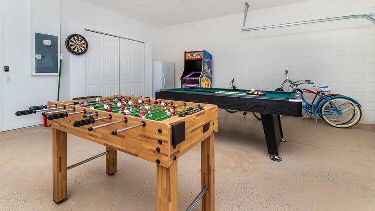 games room with foosball and arcade game