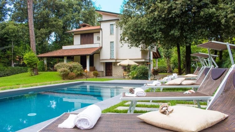 modern villa with pool and loungers
