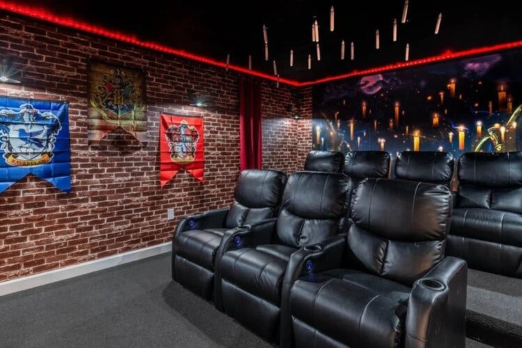 hogwarts themed home movie theater with black seats