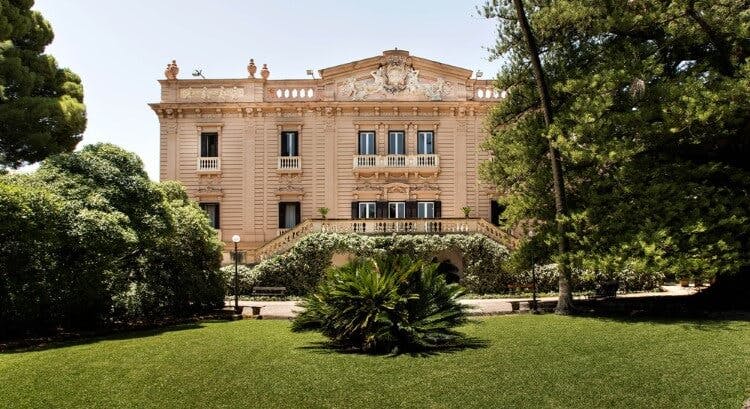 Historia Sicily villa - a large, grand mansion with large lawned garden and staircase in front