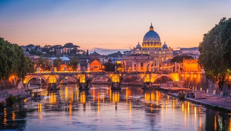 Rome city skyline at dusk, with St Peter's Basilica