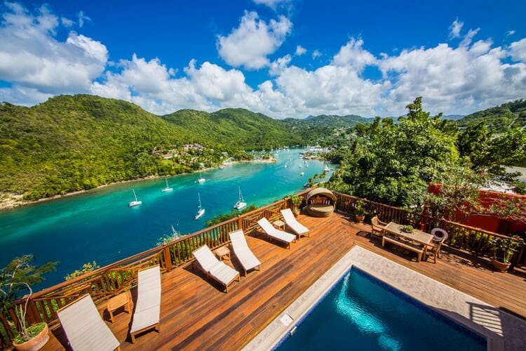 pool and deck overlooking bay and mountains