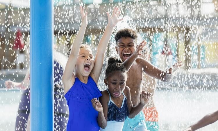children playing in water park
