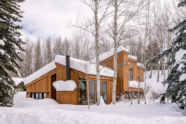 wooden cabin in the snow