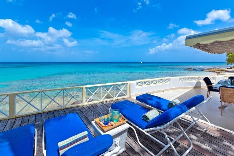 Sunset Reach villa deck area with sun loungers overlooking the Caribbean Sea