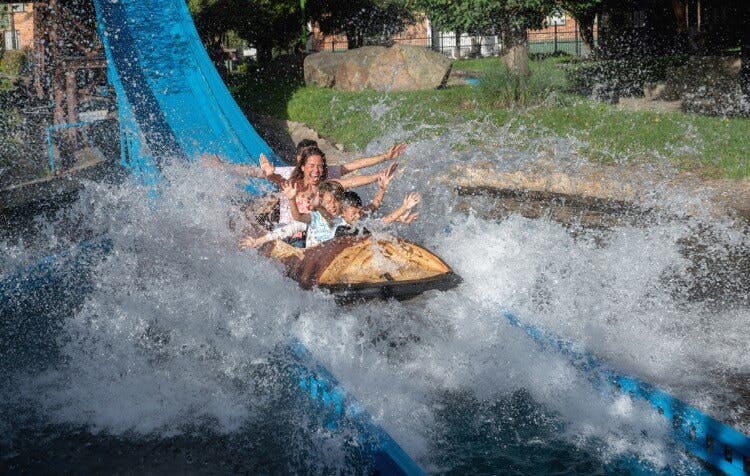 A family on a log flume ride