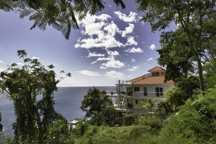 villa in distance overlooking ocean
