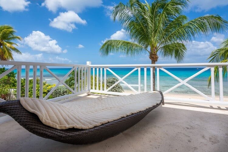 lounging bed on balcony overlooking beach