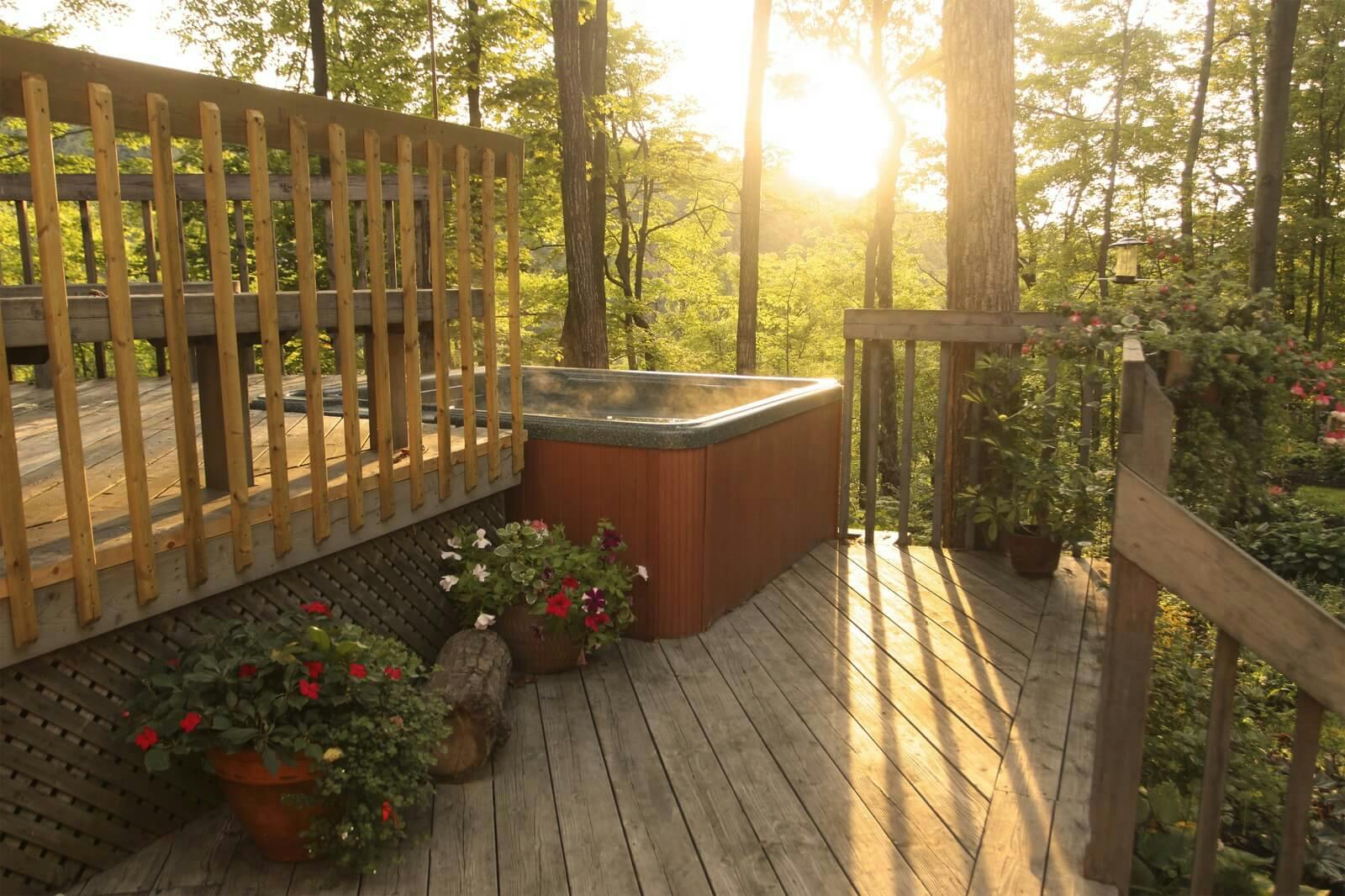 hot tub on a deck at sunset