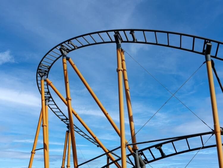 rollercoaster track against blue sky