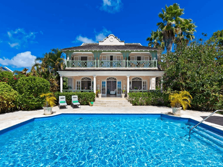 large villa with big pool in foreground