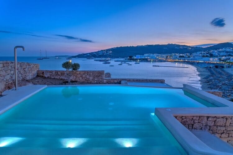pool overlooking bay and water at dusk