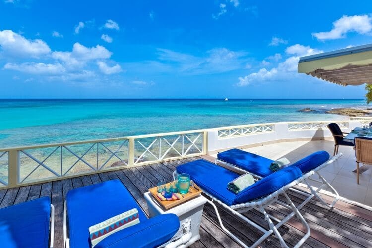 loungers on terrace overlooking ocean