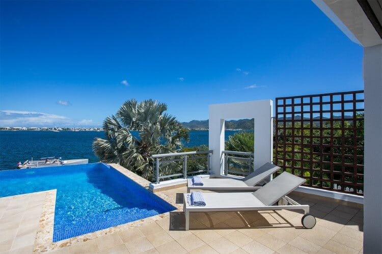 Allegra rental - image of the pool with sun lingers and Caribbean Sea view