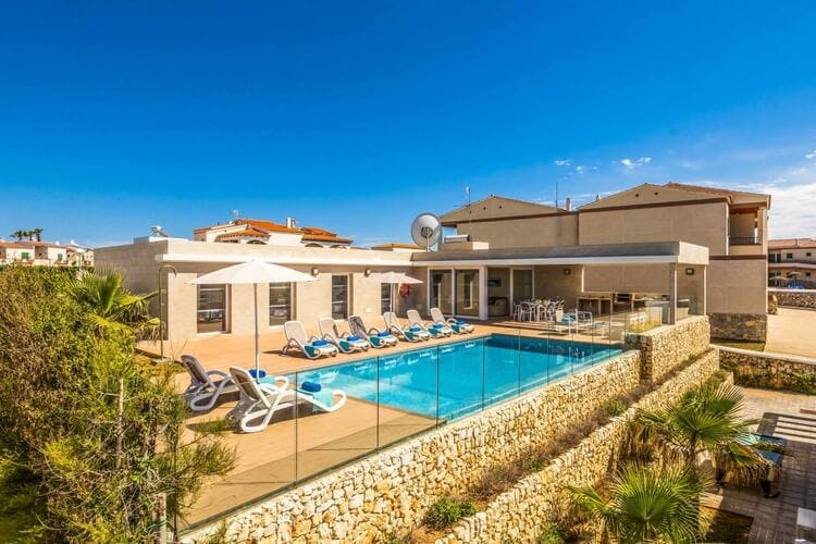 villa with pool and loungers