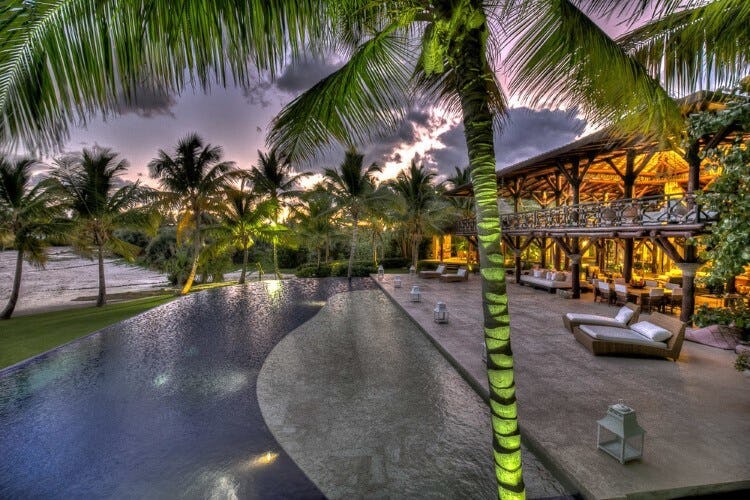 villa and pool at dusk