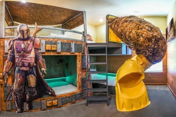 A Star Wars-themed bedroom with a slide and bunkbeds in Villatel Village 15 vacation rental