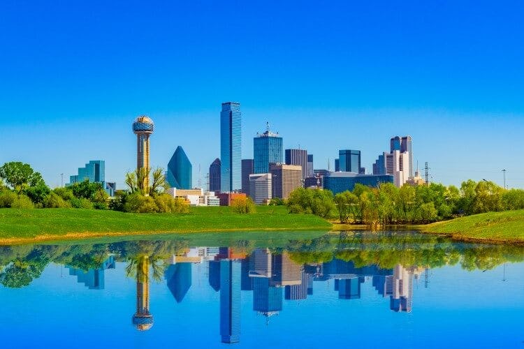 The city skyline of Dallas, Texas reflected in a still lake