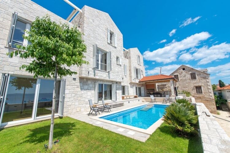 white stone villa with pool