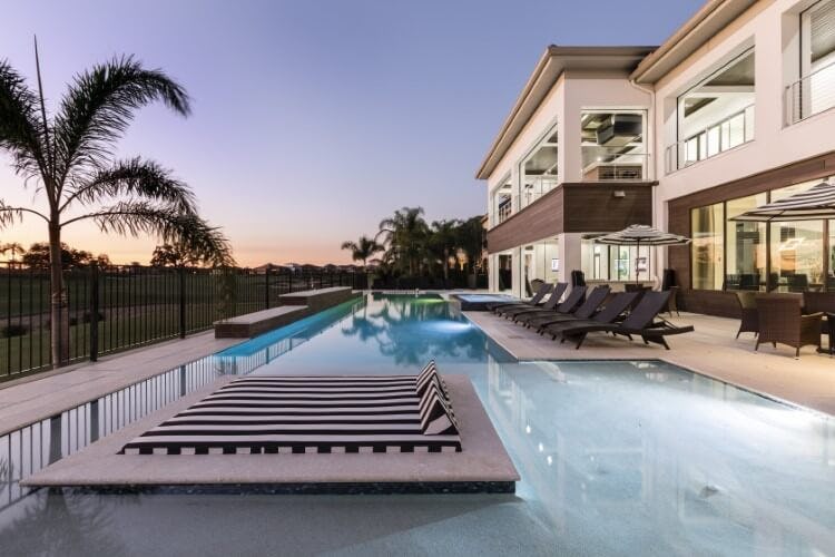 pool of white villa at dusk