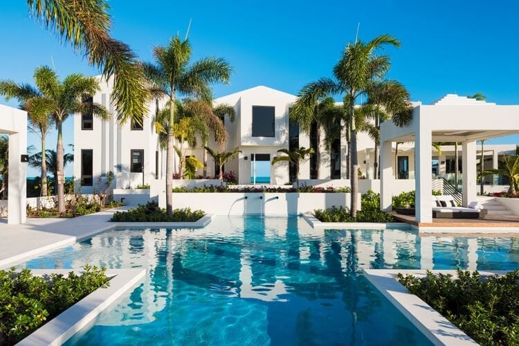 triton luxury villa with pool and palm trees