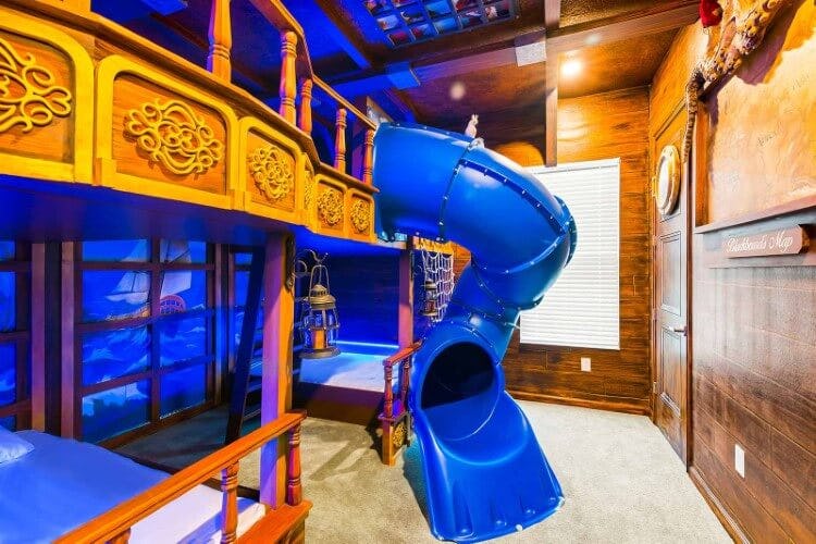 A pirate ship-themed bedroom with a slide at Villatel Village 33 vacation rental