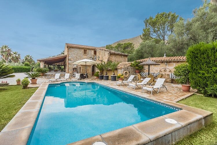 stone villa with pool