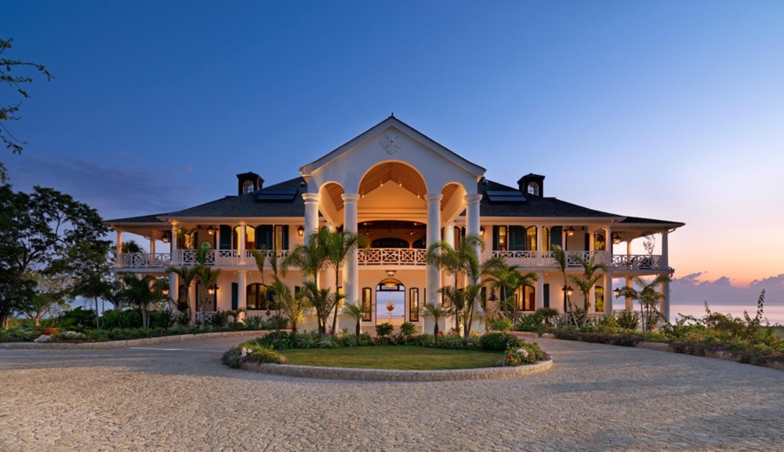 front view of flower hill villa at sunset