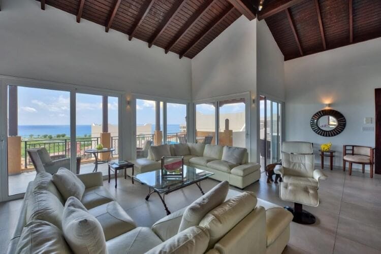 living room with balcony beyond glass doors