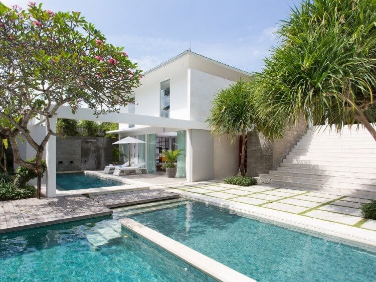 white villa with pool and steps