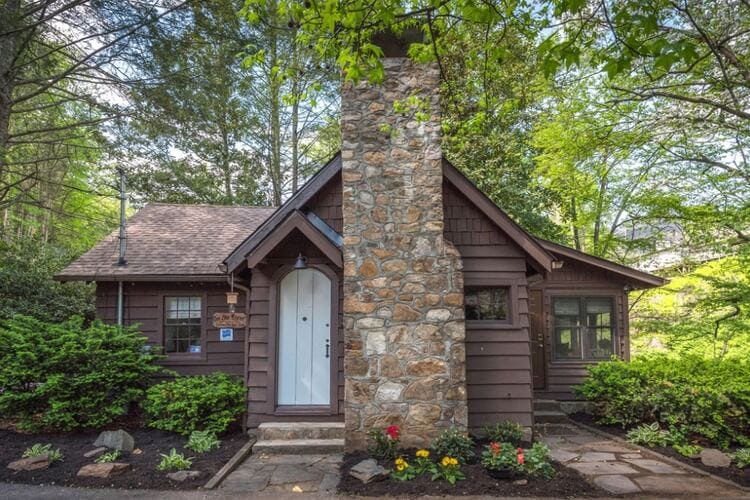 cabin in the woods with stone chimney