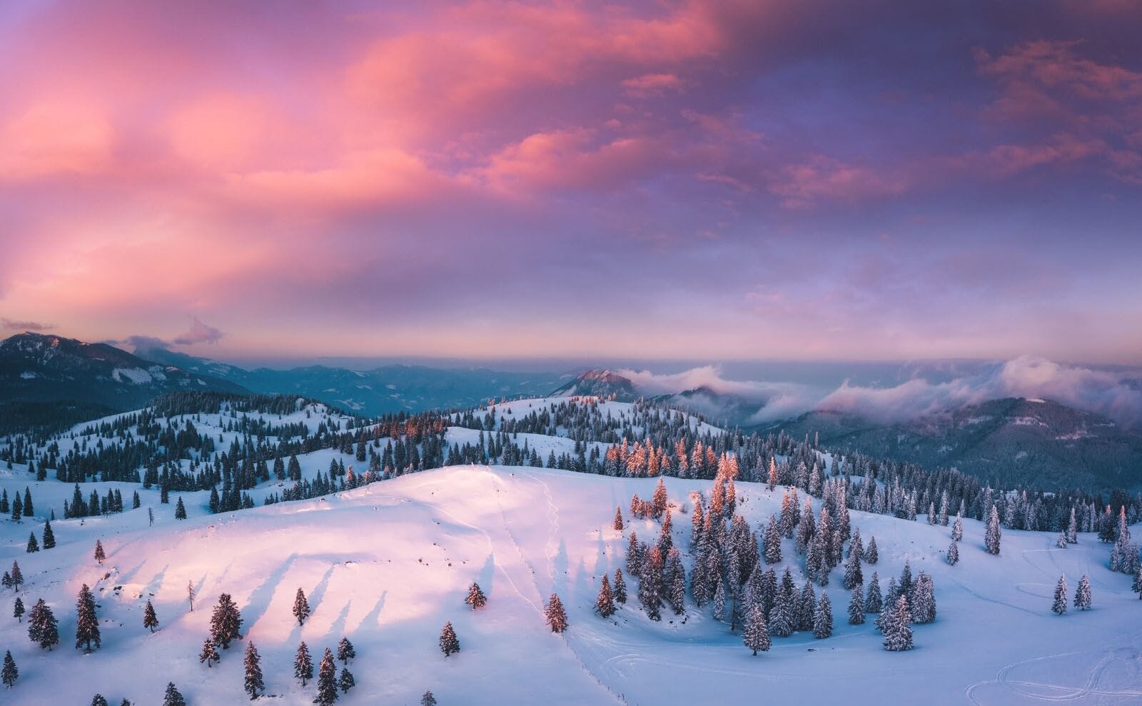 snowy mountainscape at sunset