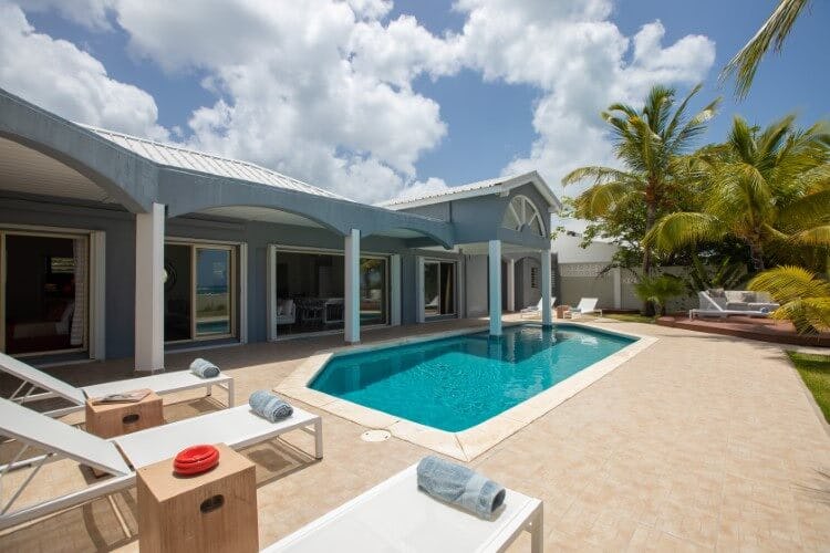 Beach Secrets vacation rental with pool and sun loungers