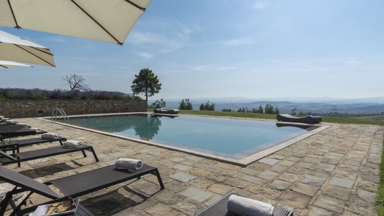 infinity pool with tuscany countryside