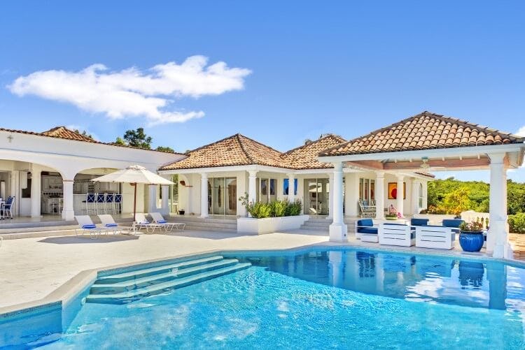 large white villa with pool