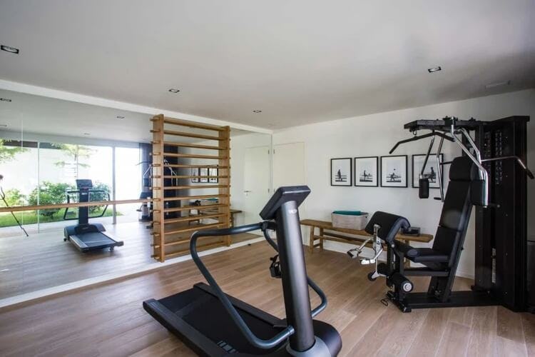 gym with mirror and treadmill