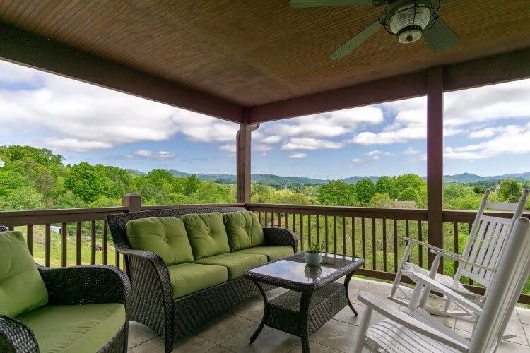 Asheville 3 vacation rental in North Carolina - image of porch with seating and small coffee table looking out over trees and mountain views